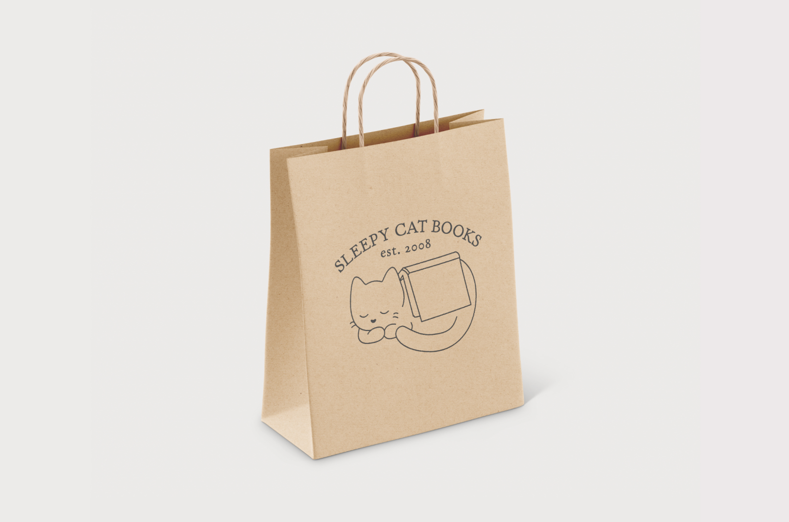 Mockup of a paper gift bag with the Sleepy Cat Books logo